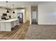 Modern kitchen with island, stainless steel appliances, and light-colored cabinetry at 310 N Brower Rd, Maricopa, AZ 85139