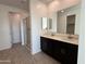 Modern bathroom with double vanity and glass shower at 4301 E Bradford Ave, San Tan Valley, AZ 85143