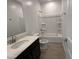 Clean bathroom with a shower/tub combo and modern vanity at 4301 E Bradford Ave, San Tan Valley, AZ 85143