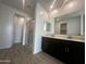 Modern bathroom with a dual-sink vanity, a frameless shower, and contemporary fixtures at 4301 E Bradford Ave, San Tan Valley, AZ 85143