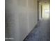 Long hallway with textured walls in new construction at 4301 E Bradford Ave, San Tan Valley, AZ 85143