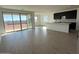 Open concept kitchen with island and modern dark cabinets at 4301 E Bradford Ave, San Tan Valley, AZ 85143