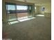 Bright living room with sliding glass doors at 4301 E Bradford Ave, San Tan Valley, AZ 85143