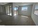 Bright living room area with natural light shining through the sliding glass door and window at 4301 E Bradford Ave, San Tan Valley, AZ 85143