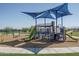 Modern playground with shade structures and multiple play features at 4638 N 178Th Ln, Goodyear, AZ 85395