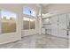 Dining area featuring large windows, tile floors, and a built in desk/cabinets at 16686 S 18Th Way, Phoenix, AZ 85048