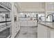 Bright kitchen featuring white cabinetry, granite countertops, and stainless steel appliances at 16686 S 18Th Way, Phoenix, AZ 85048