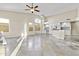 Open-concept living area with a kitchen, featuring tiled floors and plenty of natural light at 16686 S 18Th Way, Phoenix, AZ 85048