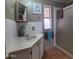 Bathroom showcasing vanity with a light-toned countertop and a glass enclosed shower at 9333 E University Dr # 89, Mesa, AZ 85207