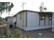 Exterior side view of a home with desert landscaping at 9333 E University Dr # 89, Mesa, AZ 85207