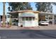 Home exterior with a dual carport and well-maintained landscaping at 9333 E University Dr # 89, Mesa, AZ 85207