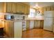 This efficient kitchen has lots of cabinets and counter space, and white appliances including a dishwasher at 9333 E University Dr # 89, Mesa, AZ 85207