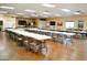 Spacious meeting room with tables and chairs, perfect for community gatherings at 9333 E University Dr # 89, Mesa, AZ 85207