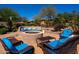 Relaxing backyard patio with firepit and seating area at 11500 E Cochise Dr # 1063, Scottsdale, AZ 85259