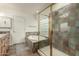 Bathroom features a garden tub, walk-in shower, and tile flooring at 13128 N 104Th Pl, Scottsdale, AZ 85260