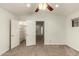 Bedroom with double door closet, additional shelving, and carpet flooring at 13128 N 104Th Pl, Scottsdale, AZ 85260