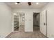 Bright bedroom with ceiling fan, large closet, and carpet flooring at 13128 N 104Th Pl, Scottsdale, AZ 85260