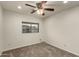 Bedroom with ceiling fan and a window with mountain view at 13128 N 104Th Pl, Scottsdale, AZ 85260