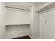 Large walk-in closet with double hanging rods and shelving at 13128 N 104Th Pl, Scottsdale, AZ 85260