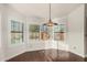 Bright dining area with large windows and wood flooring at 13128 N 104Th Pl, Scottsdale, AZ 85260