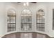 Living room with hardwood floors and large windows at 13128 N 104Th Pl, Scottsdale, AZ 85260