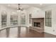 Bright living room with fireplace and hardwood floors at 13128 N 104Th Pl, Scottsdale, AZ 85260