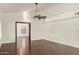 Bright living room with hardwood floors and ceiling fan at 13128 N 104Th Pl, Scottsdale, AZ 85260