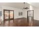 Living room with hardwood floors, patio access, and ceiling fan at 13128 N 104Th Pl, Scottsdale, AZ 85260