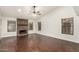 Living room with stone fireplace and hardwood floors at 13128 N 104Th Pl, Scottsdale, AZ 85260