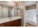 Bathroom boasts a vanity with mirror and a bathtub at 2090 S Moccasin Trl, Gilbert, AZ 85295