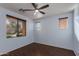 Light and airy bedroom with ceiling fan and wood floors at 2090 S Moccasin Trl, Gilbert, AZ 85295