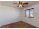 Well-lit bedroom, featuring a ceiling fan and window blinds at 2090 S Moccasin Trl, Gilbert, AZ 85295