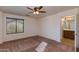 Bright bedroom with ceiling fan and carpet flooring at 2090 S Moccasin Trl, Gilbert, AZ 85295