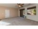 Gathering room featuring sliding door and ceiling fan at 2090 S Moccasin Trl, Gilbert, AZ 85295