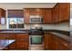 Kitchen with stainless steel appliances and granite countertops at 2090 S Moccasin Trl, Gilbert, AZ 85295