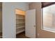 Well-lit pantry with ample shelving at 2090 S Moccasin Trl, Gilbert, AZ 85295