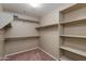 Spacious walk-in closet with double rods and shelving at 2090 S Moccasin Trl, Gilbert, AZ 85295