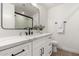 Clean bathroom featuring a white vanity, marble countertop, and black accents at 2507 E Buffalo St, Chandler, AZ 85225