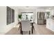 Dining area with a view to the backyard and modern kitchen at 2507 E Buffalo St, Chandler, AZ 85225