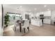 Modern dining area adjacent to kitchen with stainless steel appliances at 2507 E Buffalo St, Chandler, AZ 85225