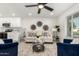 Open living room with white cabinets and stainless steel appliances at 2507 E Buffalo St, Chandler, AZ 85225