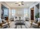 Bright living room featuring a stylish rug, modern furniture, and neutral color palette at 27587 N Makena Pl, Peoria, AZ 85383