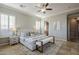 Light-filled primary bedroom with a stylish bed frame and neutral decor, creating a relaxing retreat at 27587 N Makena Pl, Peoria, AZ 85383