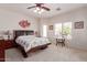 Spacious bedroom with a ceiling fan, neutral colors, and lots of natural light at 3468 E Desert Moon Trl, San Tan Valley, AZ 85143