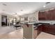 Open-concept kitchen flows into the living room, creating an ideal space for gatherings at 3468 E Desert Moon Trl, San Tan Valley, AZ 85143