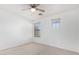 Well-lit bedroom with ceiling fan and window at 4354 E Rosemonte Dr, Phoenix, AZ 85050