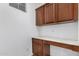 Small office space with wood cabinets and counter at 4354 E Rosemonte Dr, Phoenix, AZ 85050