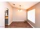 Simple dining room with hardwood floors and large window at 518 W Amoroso Dr, Gilbert, AZ 85233