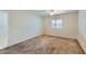 Well-lit bedroom with neutral walls and carpeted floor at 13235 N 25Th Dr, Phoenix, AZ 85029