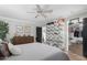 Bright bedroom with a display of sneakers and ceiling fan at 3637 E Monterosa St # 17, Phoenix, AZ 85018